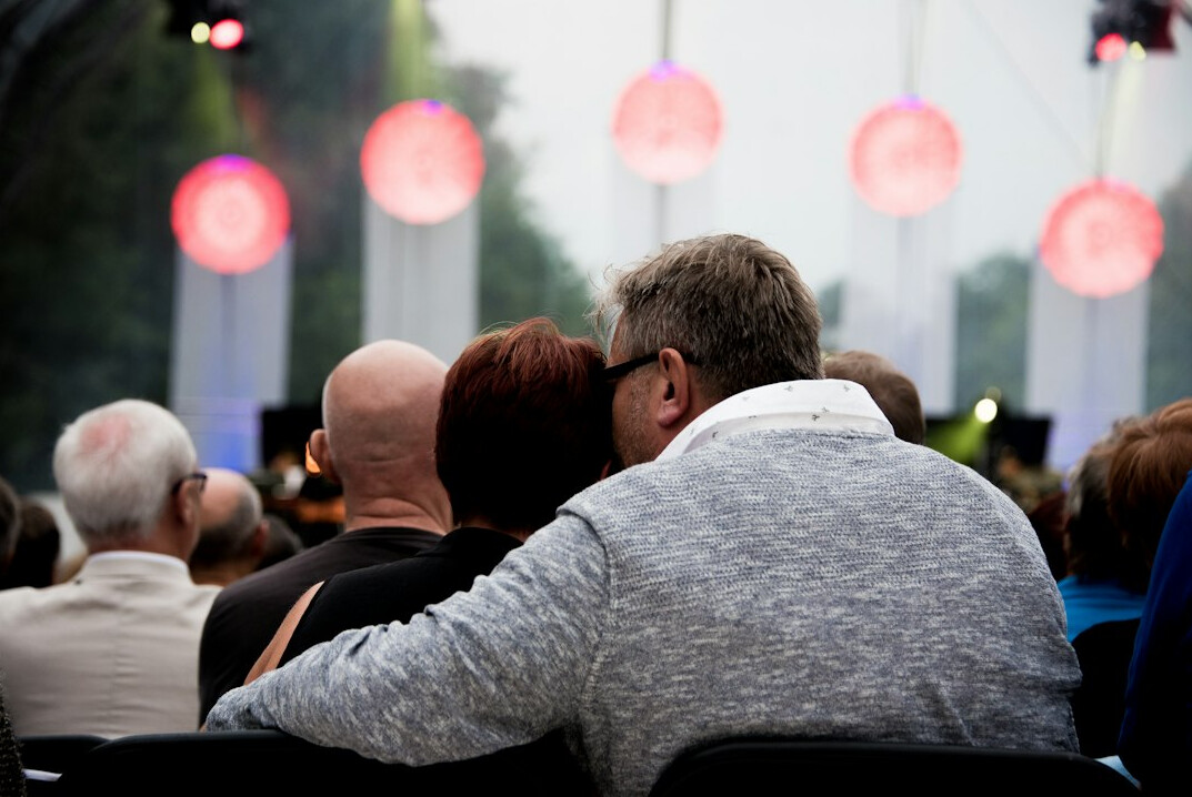 Audience listening to a speaker at a conference